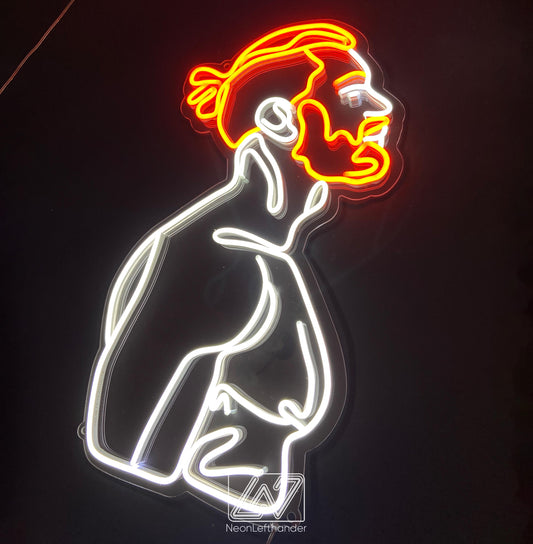 Neon sign of a male figure, perfect for modern decor and unique gifts.